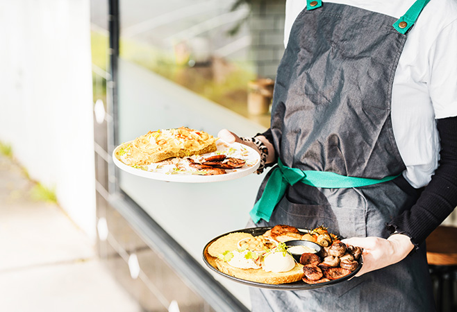 Signature Melbourne brunch dishes including smashed avocado eggs Benedict and ricotta hotcakes, served with speciality coffee