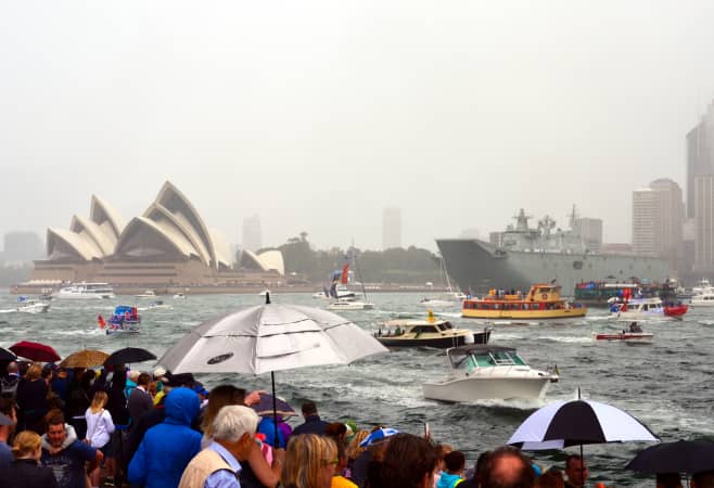 Covered Sydney Harbour cruise during rainy weather with views of the Opera House
