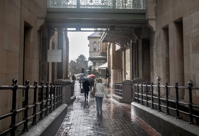Visitors exploring the Australian Museum on a rainy day in Sydney